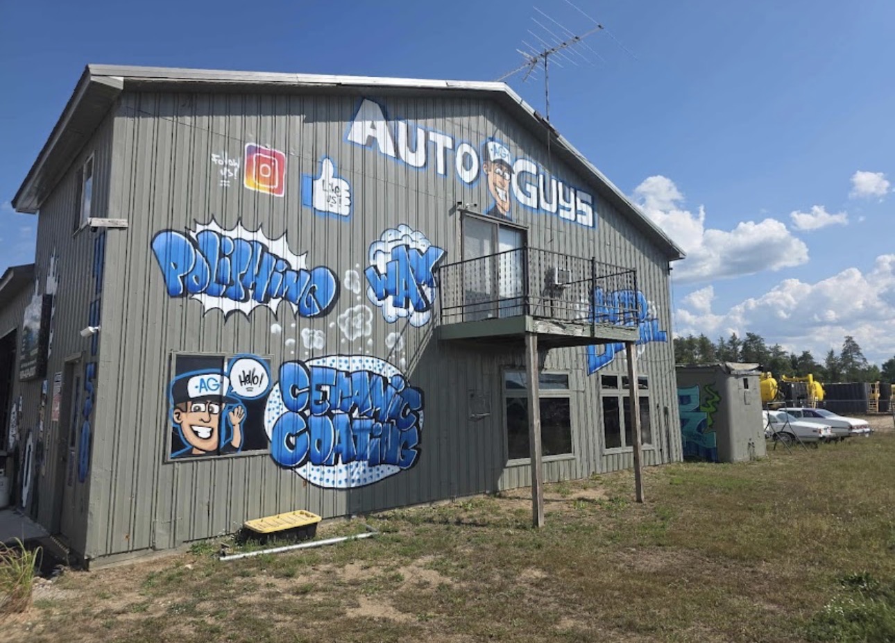 The Auto Guys shop building with its hand-painted mural